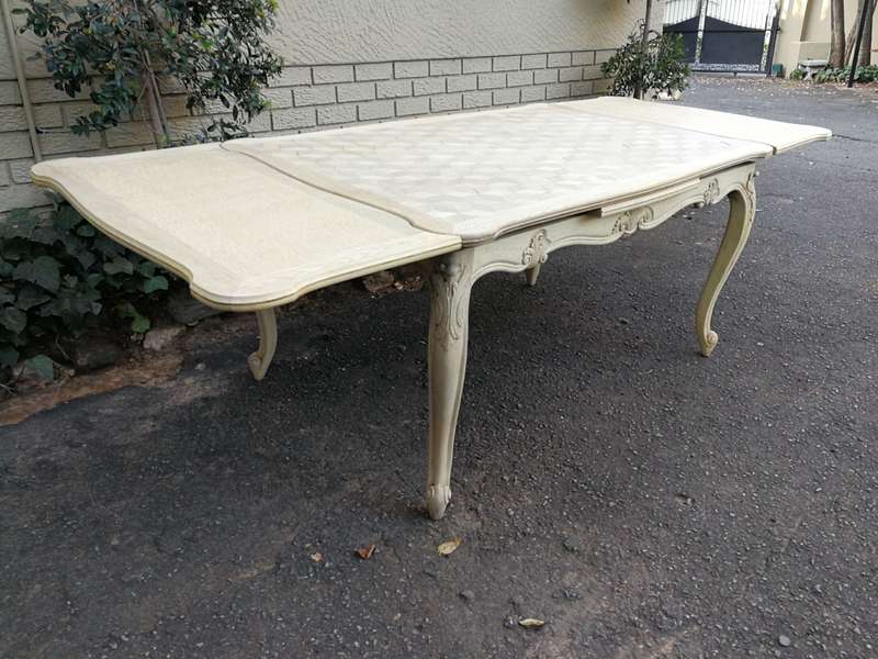 A 20TH Century French Set of Six Carved Dining Chairs with Rush Seats in a Contemporary Bleached ...