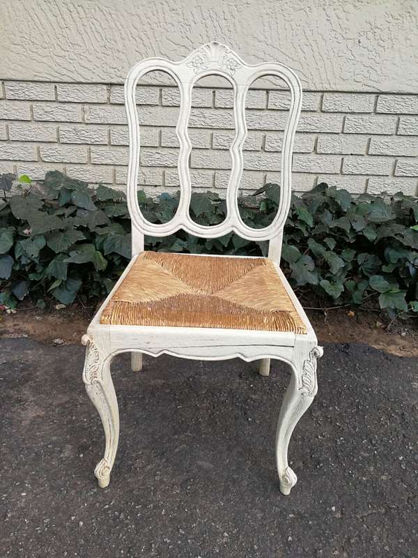 A 20TH Century French Set of Six Carved Dining Chairs with Rush Seats in a Contemporary Bleached ...