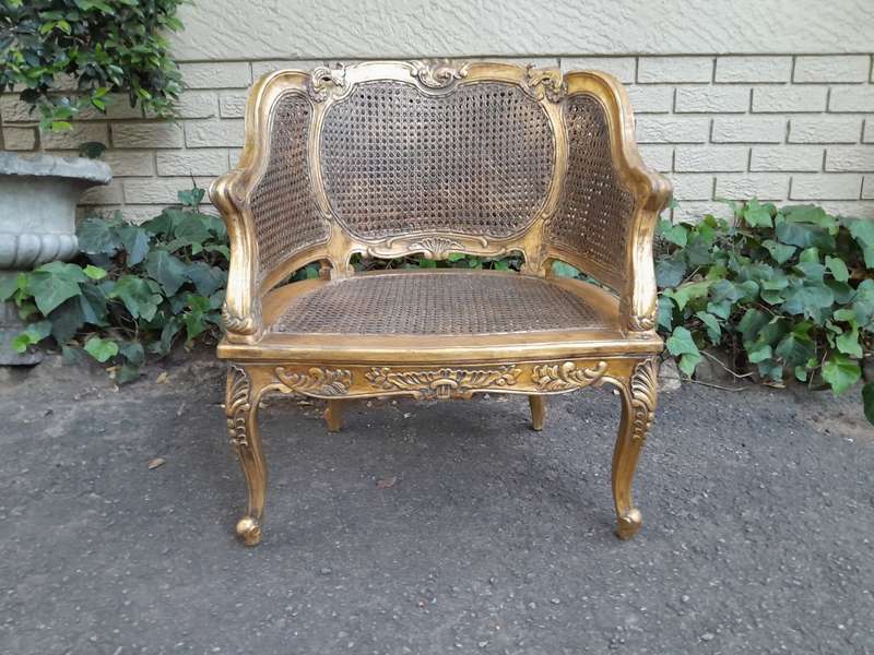 A 20th Century Pair or French Bergere Style Carved and Hand Gilded in Gold Leaf Wooden Chairs