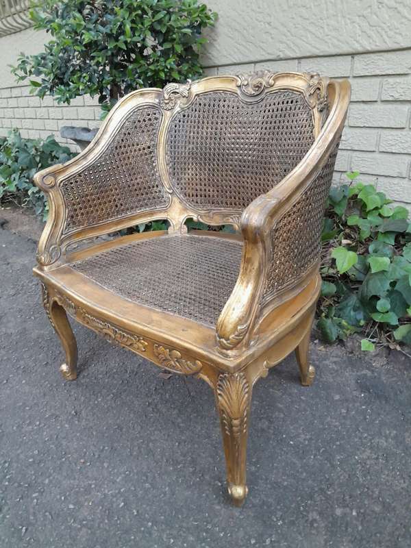 A 20th Century Pair or French Bergere Style Carved and Hand Gilded in Gold Leaf Wooden Chairs