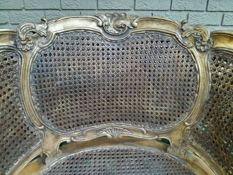 A 20th Century Pair or French Bergere Style Carved and Hand Gilded in Gold Leaf Wooden Chairs