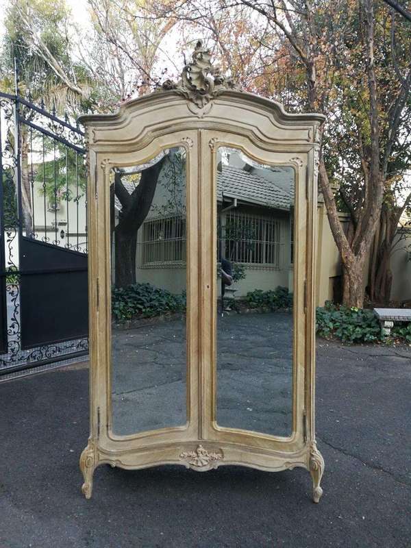 A 19th Century French Rococo Armoire In A Bleached Contemporary Finish With Bevelled Mirrors