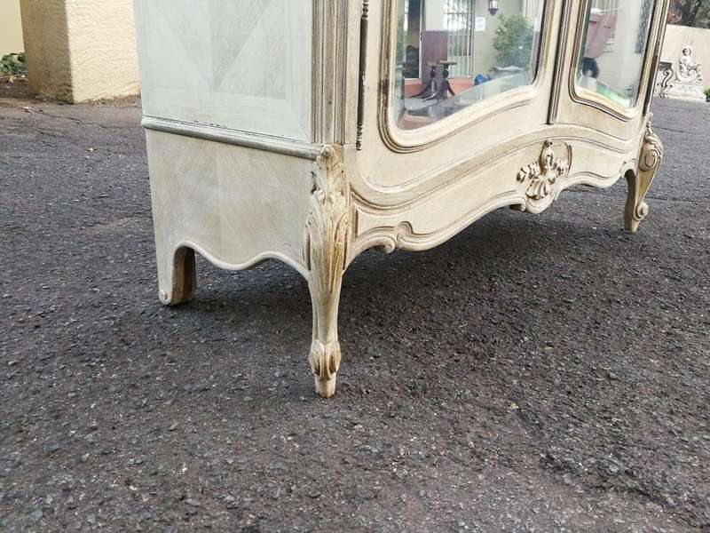 A 19th Century French Rococo Armoire In A Bleached Contemporary Finish With Bevelled Mirrors