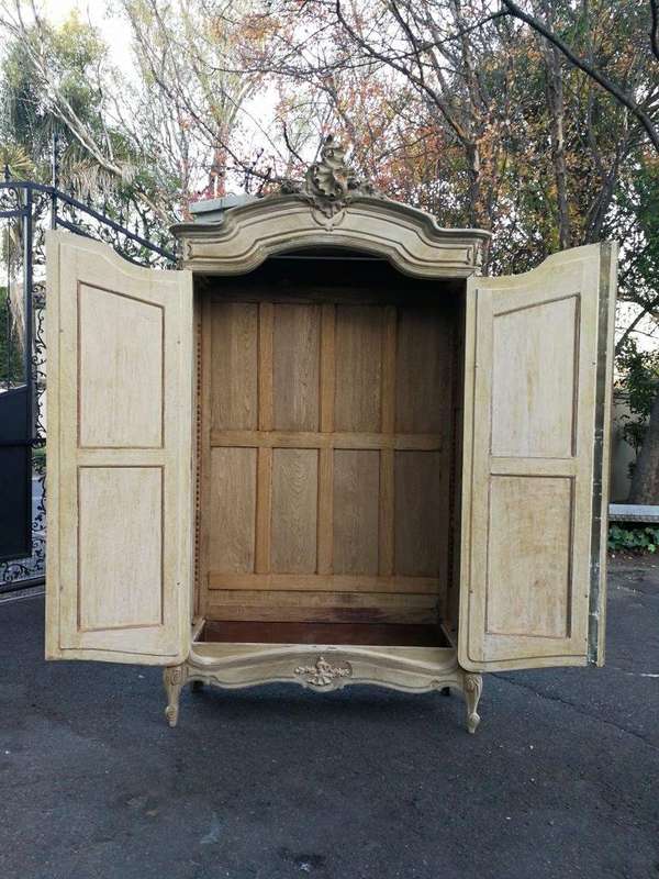 A 19th Century French Rococo Armoire In A Bleached Contemporary Finish With Bevelled Mirrors