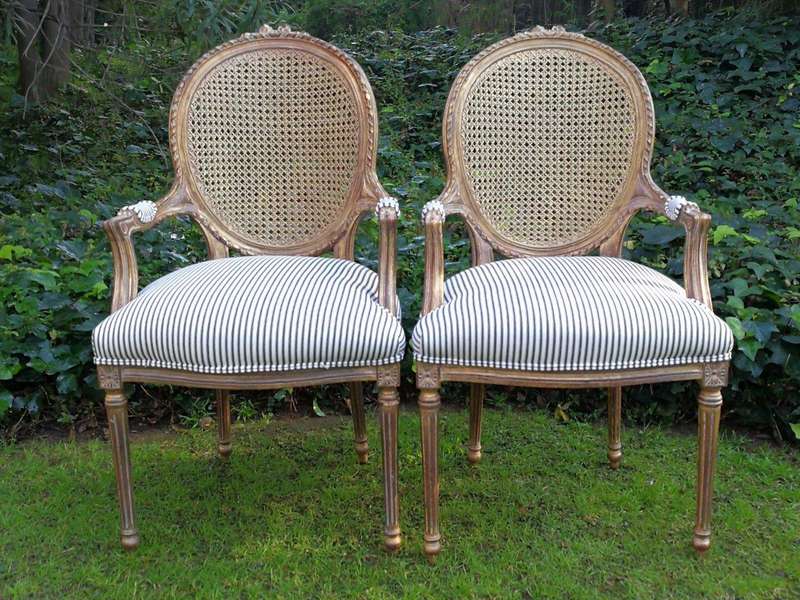 A 20th Century French Style Imported Set Of Twelve Gilded Dining Chairs Comprising: Two Carvers  ...