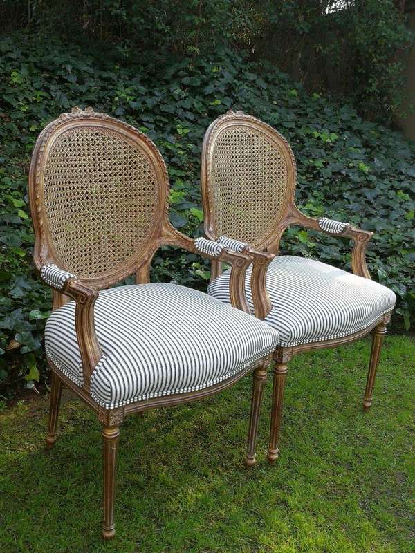 A 20th Century French Style Imported Set Of Twelve Gilded Dining Chairs Comprising: Two Carvers  ...