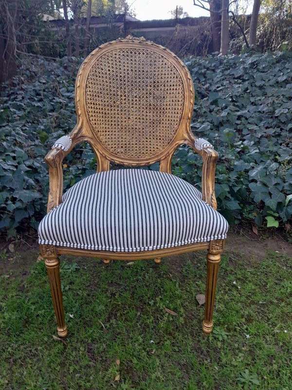 A 20th Century French Style Imported Set Of Twelve Gilded Dining Chairs Comprising: Two Carvers  ...