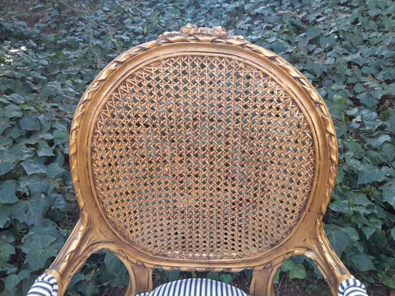 A 20th Century French Style Imported Set Of Twelve Gilded Dining Chairs Comprising: Two Carvers  ...