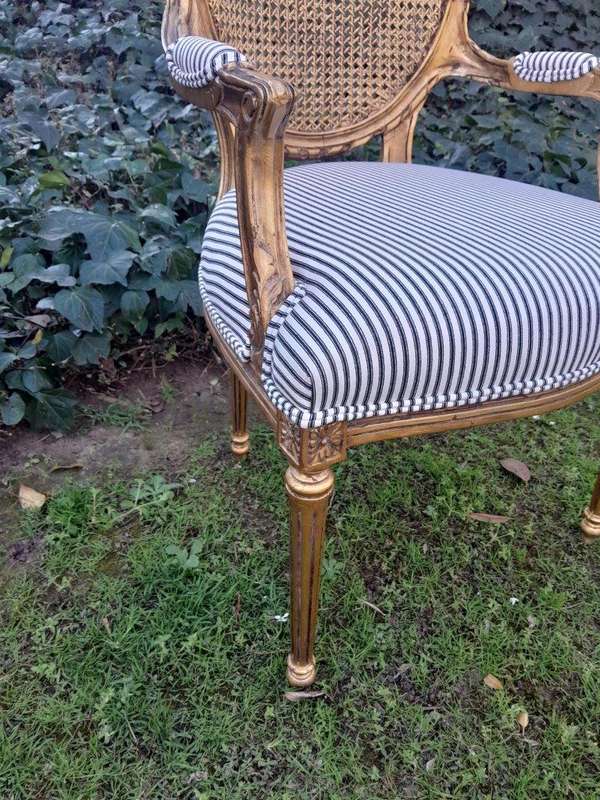 A 20th Century French Style Imported Set Of Twelve Gilded Dining Chairs Comprising: Two Carvers  ...