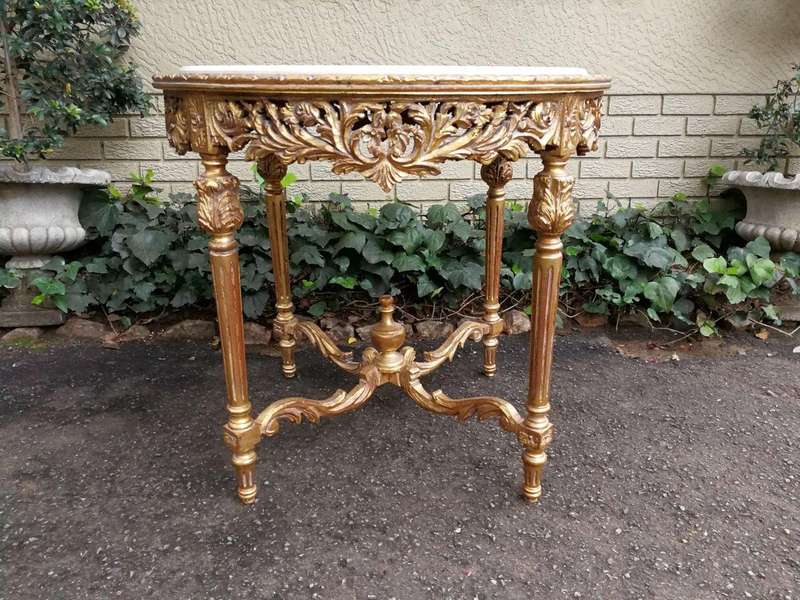 A French Style Ornately Carved Marble top Centre Table