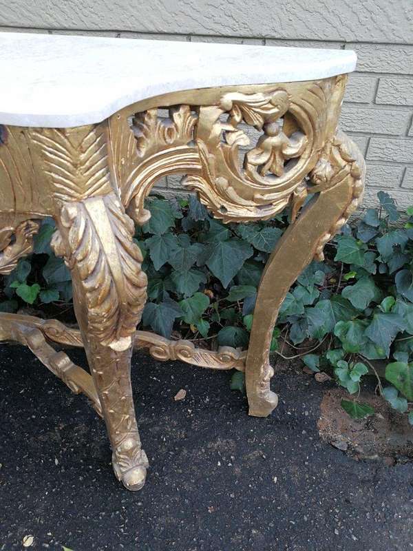 A French Rococo Style Ornately Carved Marble top Console Table