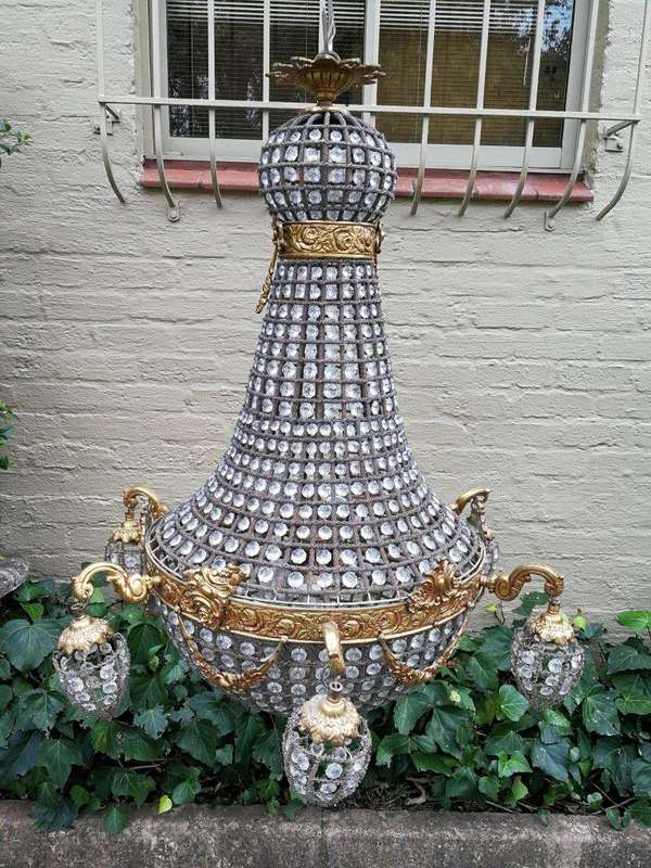A French Empire Style Brass and Gilt Chandelier