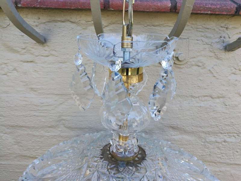 A French Style Brass and Crystal Plate Chandelier with Floral top