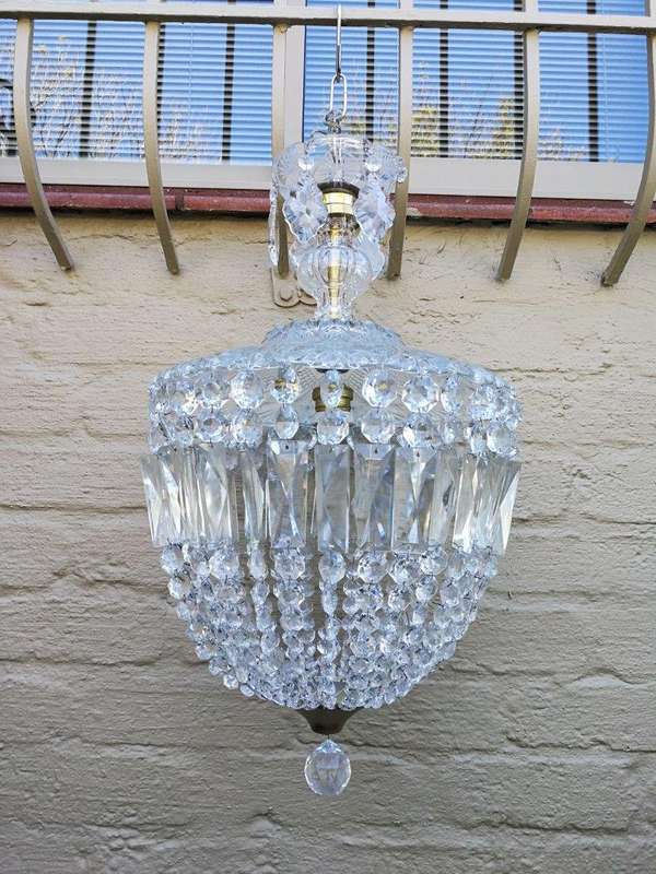 A French Style Brass and Crystal Plate Chandelier with Floral Top