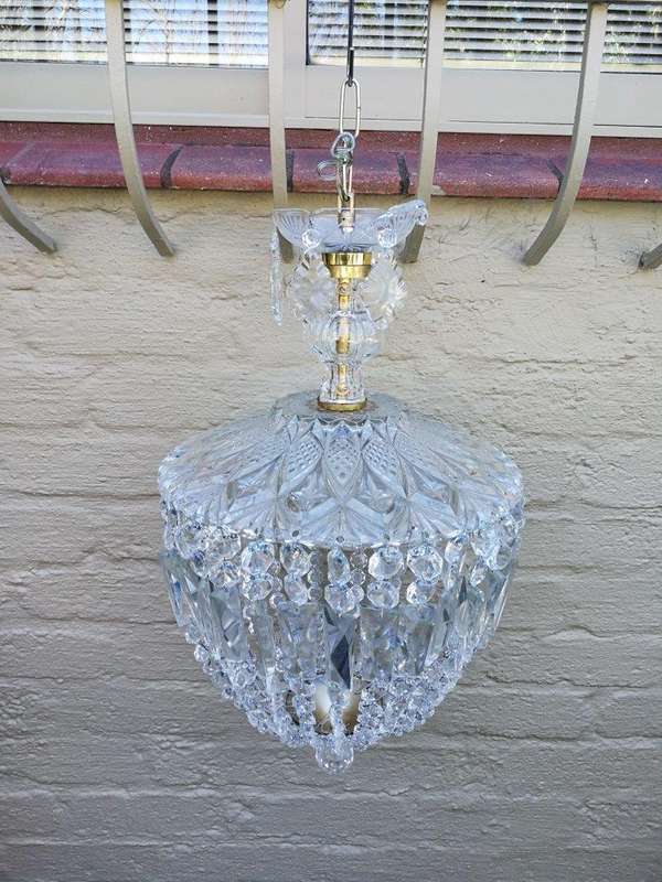 A French Style Brass and Crystal Plate Chandelier with Floral Top