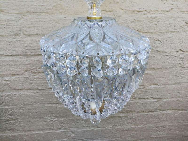 A French Style Brass and Crystal Plate Chandelier with Floral Top
