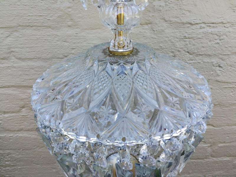 A French Style Brass and Crystal Plate Chandelier with Floral Top