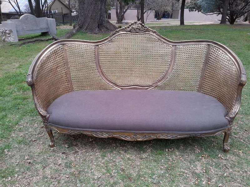A Gilded Rattan Back Settee