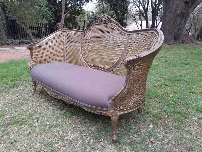 A Gilded Rattan Back Settee