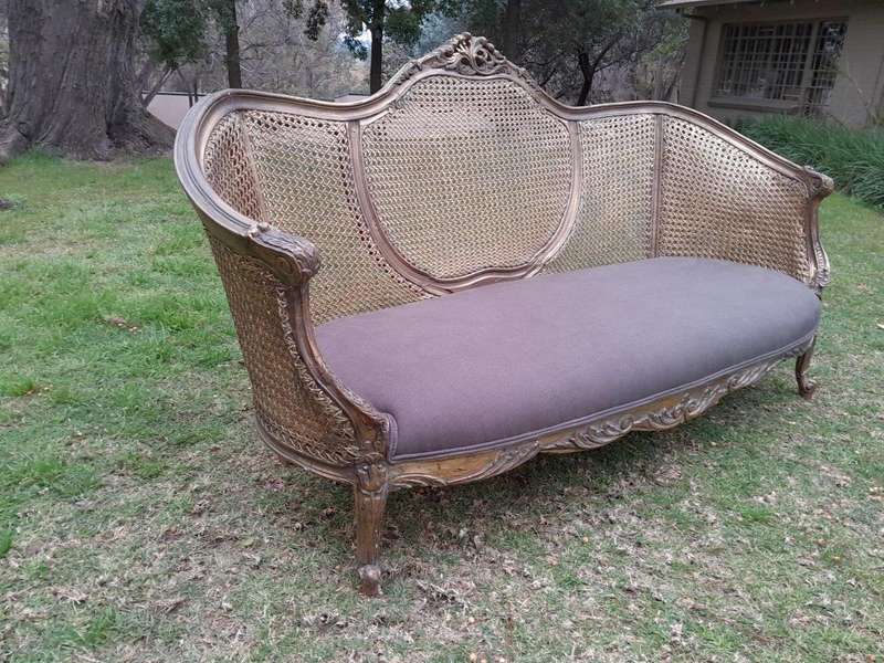 A Gilded Rattan Back Settee