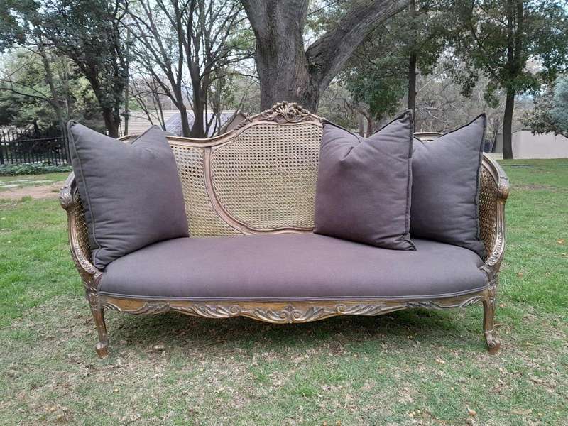 A Gilded Rattan Back Settee