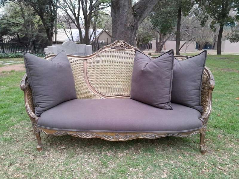 A Gilded Rattan Back Settee