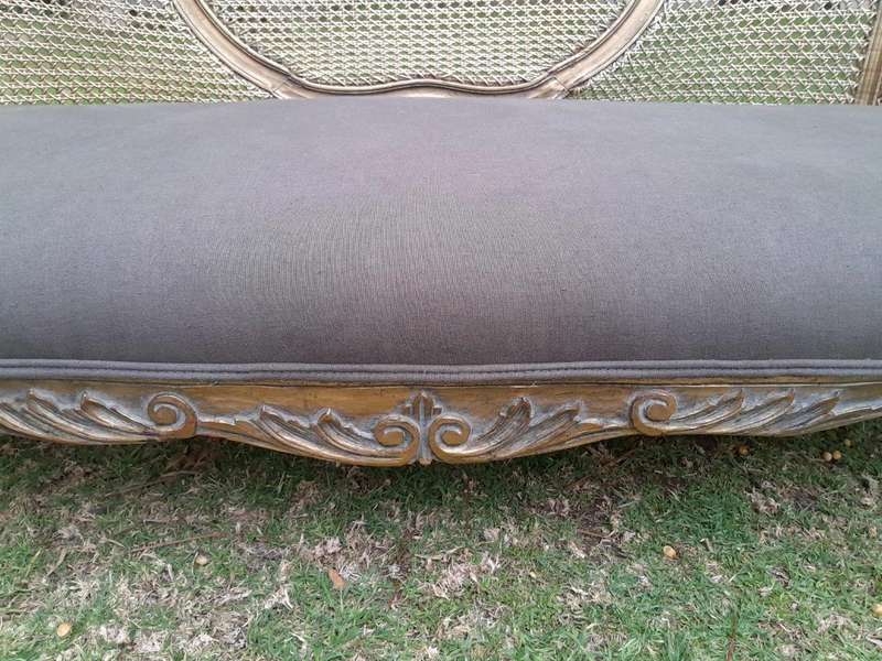 A Gilded Rattan Back Settee
