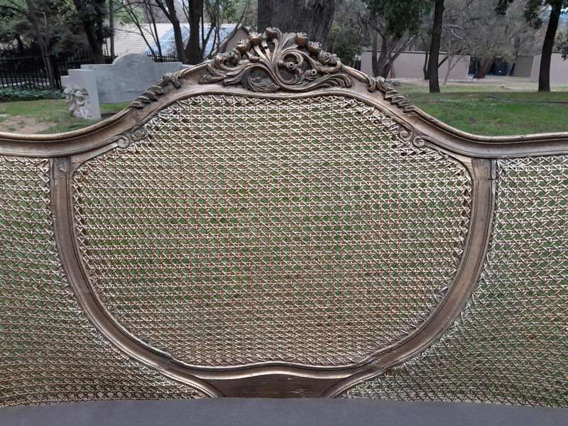 A Gilded Rattan Back Settee