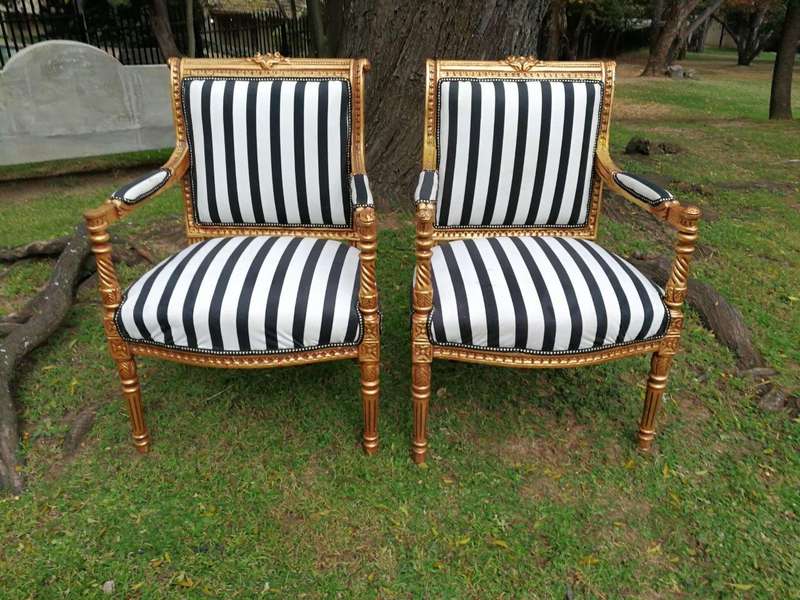 A Pair Of Louis XVI Style Carved And Gilded Armchairs