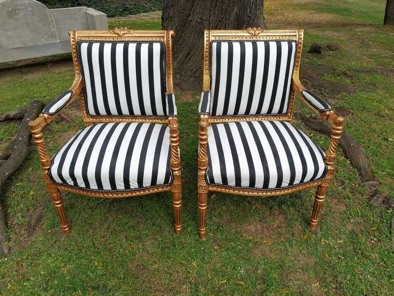 A Pair Of Louis XVI Style Carved And Gilded Armchairs