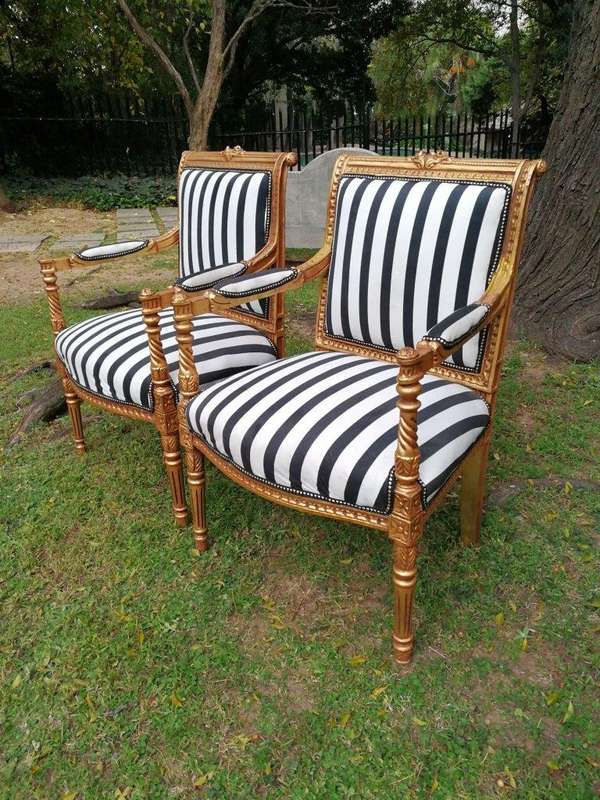 A Pair Of Louis XVI Style Carved And Gilded Armchairs