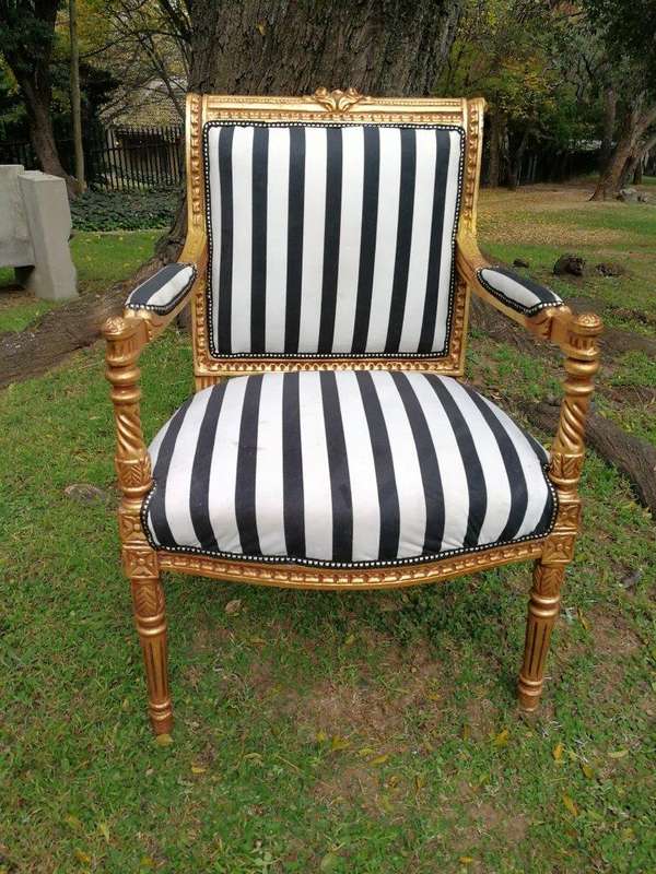 A Pair Of Louis XVI Style Carved And Gilded Armchairs