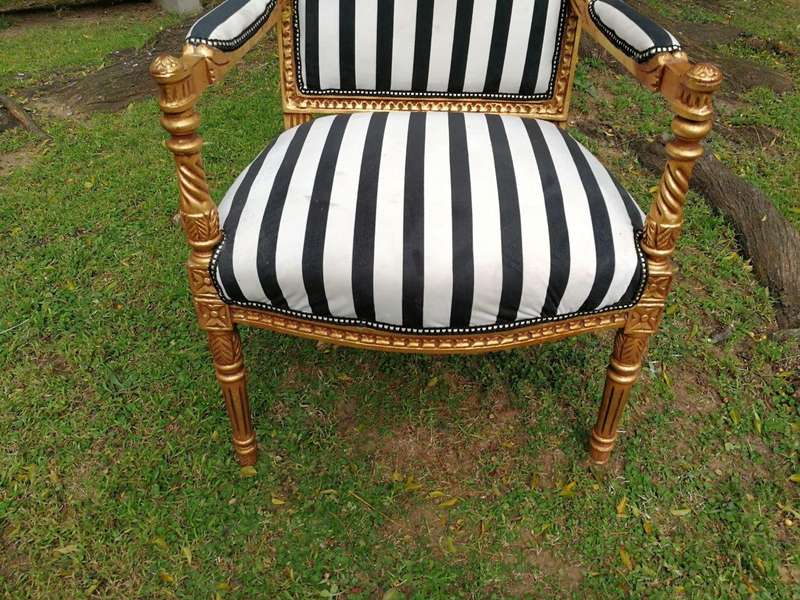 A Pair Of Louis XVI Style Carved And Gilded Armchairs