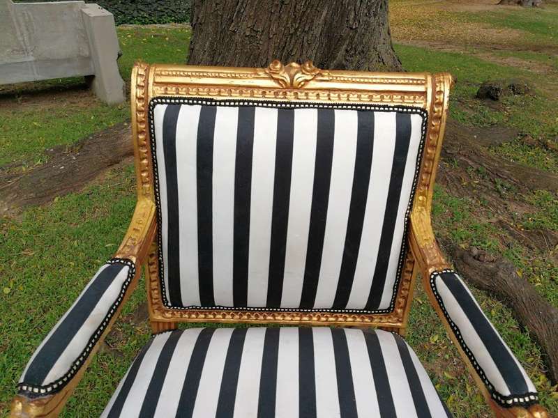 A Pair Of Louis XVI Style Carved And Gilded Armchairs