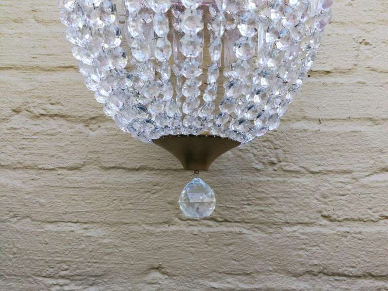 A French Style Brass and Crystal Plate Chandelier with a Floral Cerise Top