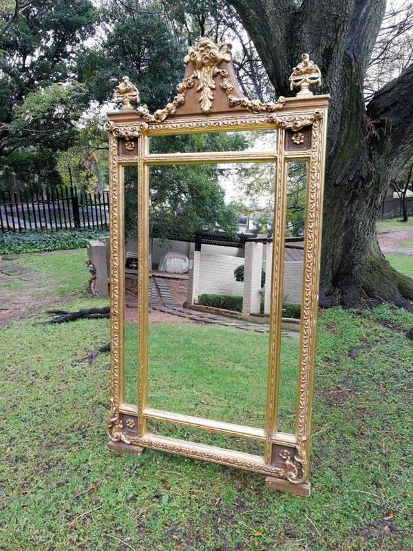 A French Style Ornately Carved and Gilded Bevelled Mirror