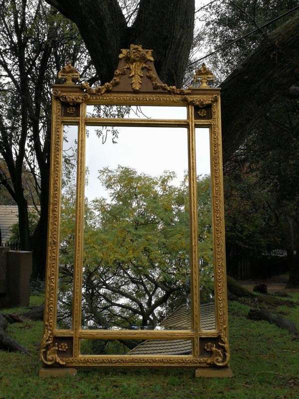 A French Style Ornately Carved and Gilded Bevelled Mirror