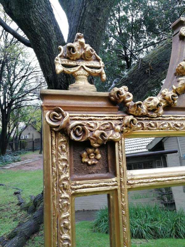 A French Style Ornately Carved and Gilded Bevelled Mirror