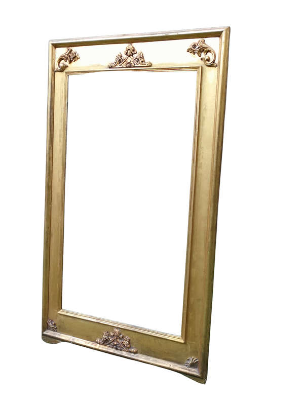 A French Style Ornately Carved and Gilded Bevelled Mirror