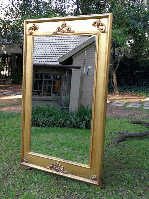 A French Style Ornately Carved and Gilded Bevelled Mirror