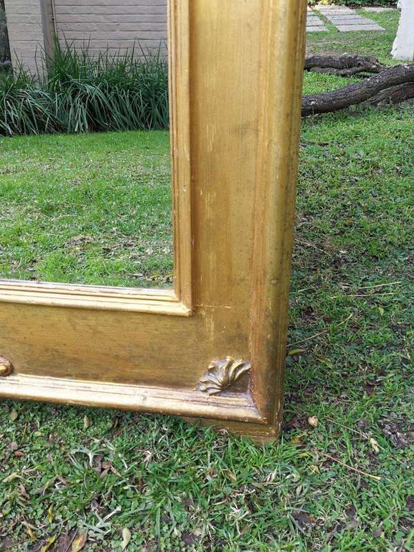 A French Style Ornately Carved and Gilded Bevelled Mirror