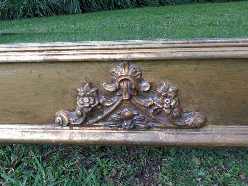 A French Style Ornately Carved and Gilded Bevelled Mirror