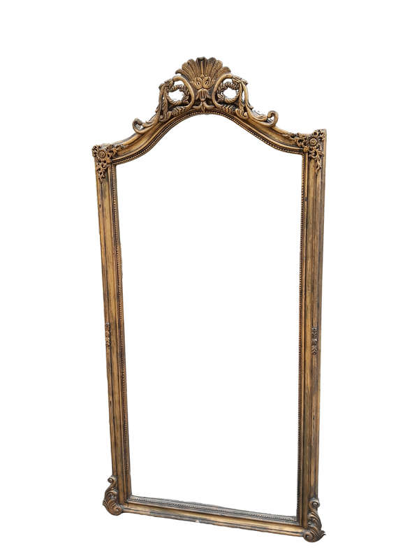 A French Style Rococo Ornately Carved And Gilded Bevelled Mirror