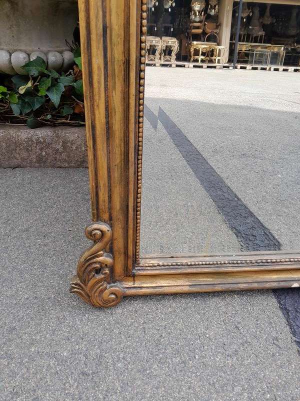 A French Style Rococo Ornately Carved And Gilded Bevelled Mirror