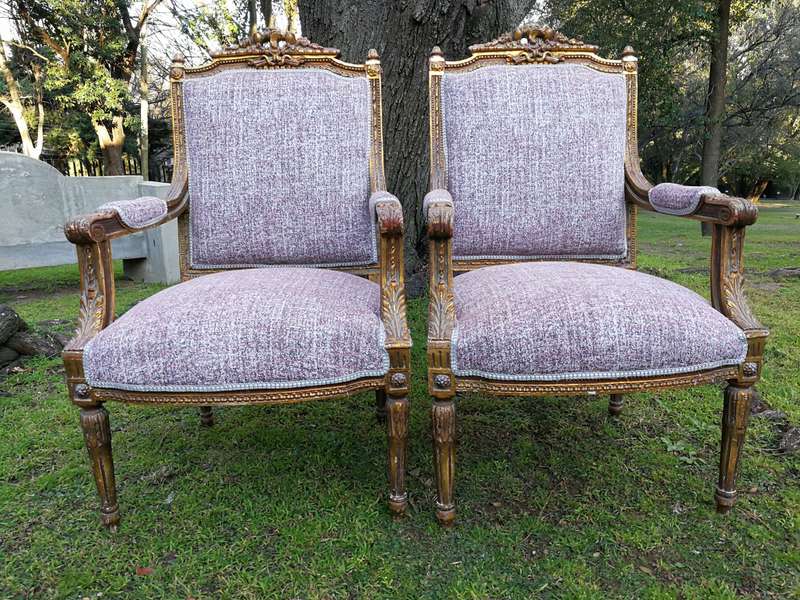A Pair Of French Style Giltwood Ornate Arm Chairs On Fluted Legs