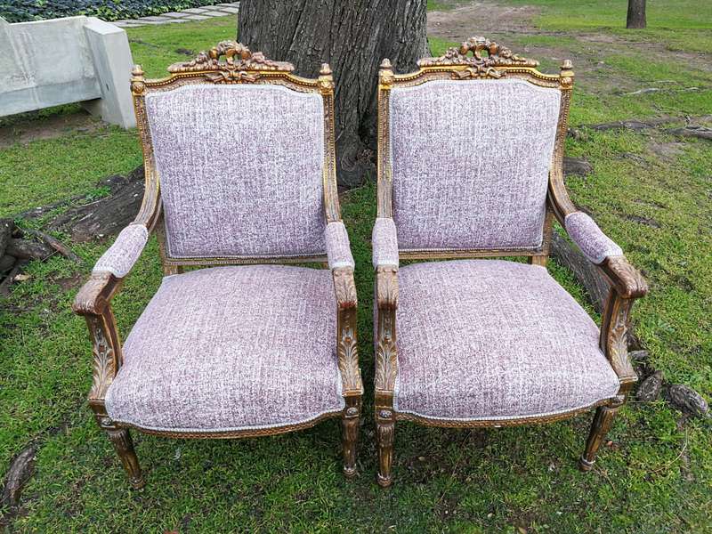 A Pair Of French Style Giltwood Ornate Arm Chairs On Fluted Legs
