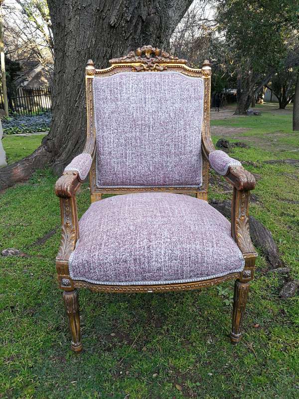 A Pair Of French Style Giltwood Ornate Arm Chairs On Fluted Legs