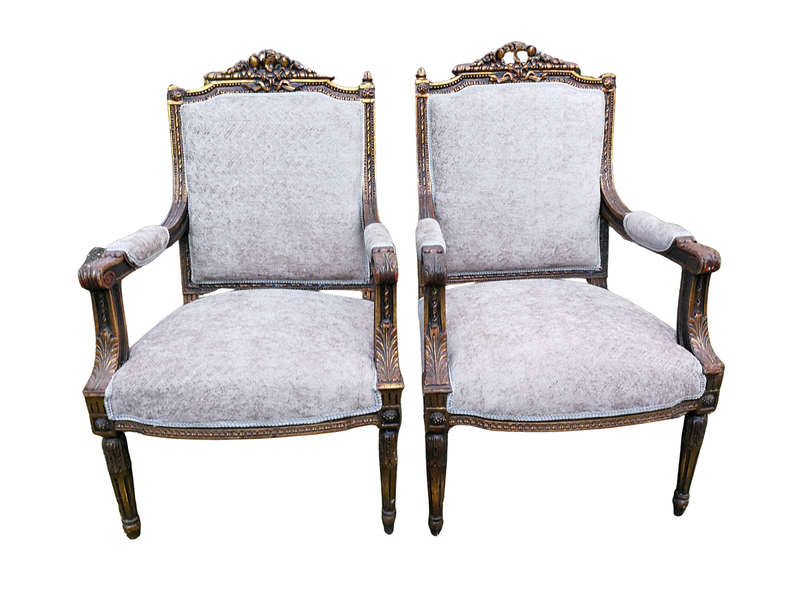 A Pair of French Style Giltwood Ornate Arm Chairs on Fluted legs 