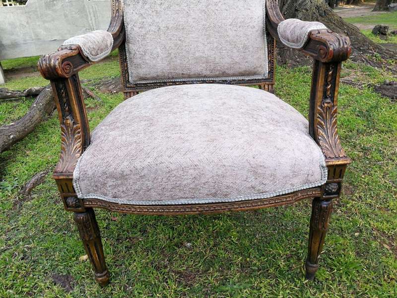 A Pair of French Style Giltwood Ornate Arm Chairs on Fluted legs 
