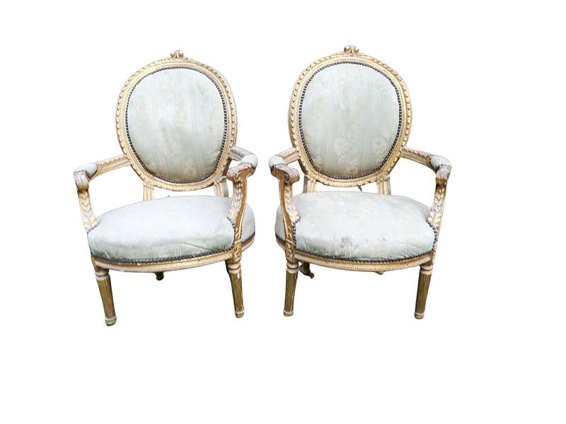A Pair Of French Style Giltwood Ornate Arm Chairs On Fluted Legs 